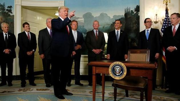 US President Donald Trump accuses a CNN reporter of being "fake news" after signing a memorandum directing the US Trade Representative to complete a review of trade issues with China at the White House in Washington on August 14, 2017. (REUTERS)