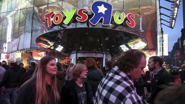 People walk past a Toys R Us store in Times Square in New York. (Reuters file) People walk past a Toys R Us store in Times Square in New York. (Reuters file)