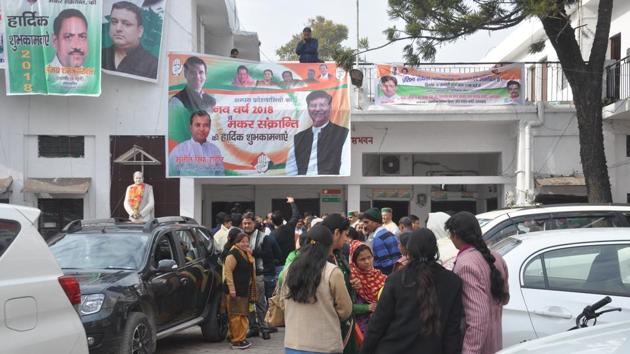 People outside Congress state headquarters in Dehradun.(HT Photo)