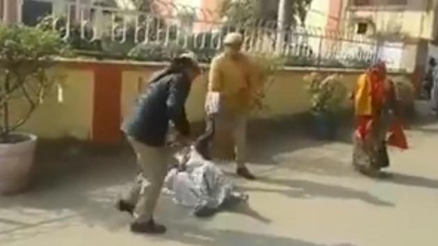 A video grab of women police personnel beating up a woman in Sitapur.