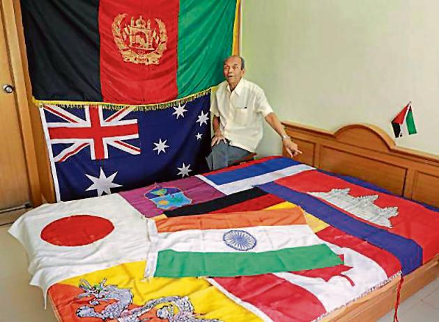Shrikant Joshi with his collection of flags. (RAHUL RAUT/HT PHOTO) Shrikant Joshi with his collection of flags. (RAHUL RAUT/HT PHOTO)