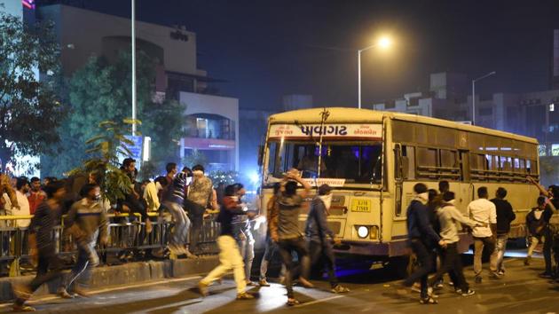 Members of the Rajput community pelt stones on a bus in protest against 'Padmaavat' in Ahmedabad. The Supreme court on January 23 rejected a final bid by Rajasthan and Madhya Pradesh to ban the film’s release which sparked violent protests and threats by fringe groups in recent months. (Sam Panthaky / AFP)