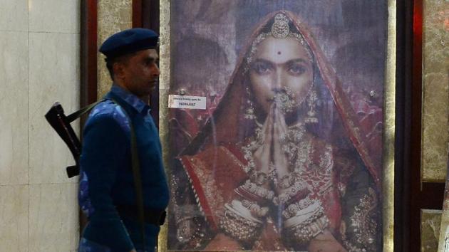 An Indian Rapid Action Force (RAF) personnel patrols a cinema hall scheduled to Padmaavat in New Delhi . (AFP) An Indian Rapid Action Force (RAF) personnel patrols a cinema hall scheduled to Padmaavat in New Delhi . (AFP)