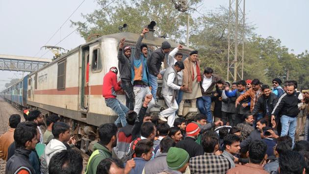 A group of people stopped a train at Bhuteshwar railway station during protests against the film ‘Padmaavat’, in Mathura. Several incidents of violent protests are being reported in different parts of the nation against the release of the movie. (AFP)