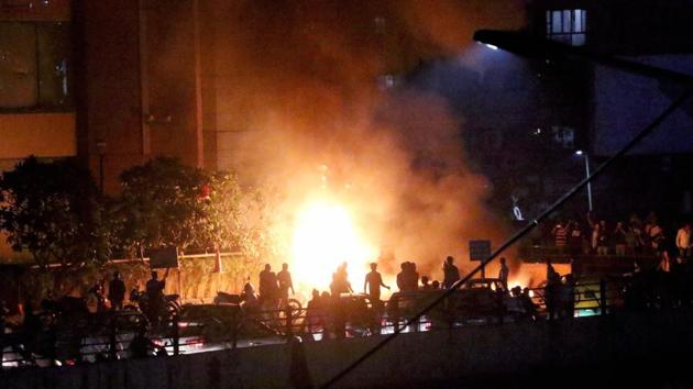 Vehicles are set on fire by a mob during the protests. “16 people have been arrested and their interrogation is underway. The CCTV footage will be examined and more arrests will be made”, a senior police official confirmed to the media. (PTI)