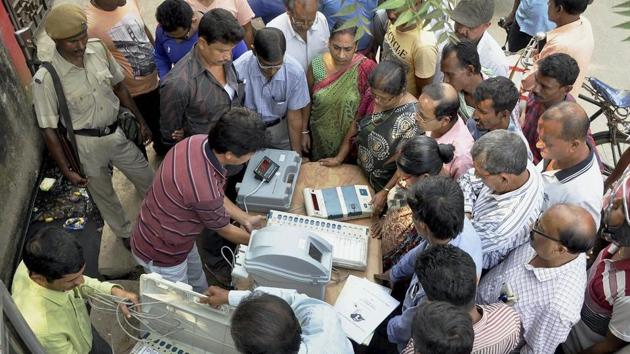 Election officers demonstrate the functioning of an Electronic Voter Verified Paper Machine (VVPAT) during an awareness program at a market place in Agartala. (PTI File Photo) Election officers demonstrate the functioning of an Electronic Voter Verified Paper Machine (VVPAT) during an awareness program at a market place in Agartala. (PTI File Photo)