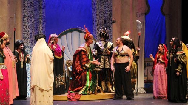 Kenneth Weber, center, as Bey of Tangier, and Taylor Miller, as Dennis O'Grady, caught masquerading as a harem girl with a bottle of Tabasco in his top, perform during the New Orleans Opera's dress rehearsal of "Tabasco: A Burlesque Opera" at Le Petit Theatre in New Orleans. (AP) Kenneth Weber, center, as Bey of Tangier, and Taylor Miller, as Dennis O'Grady, caught masquerading as a harem girl with a bottle of Tabasco in his top, perform during the New Orleans Opera's dress rehearsal of "Tabasco: A Burlesque Opera" at Le Petit Theatre in New Orleans. (AP)