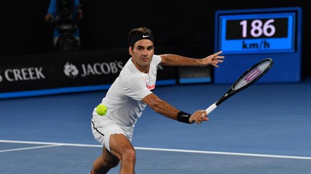 Federer plays a backhand return against Tomas Berdych. (AFP)