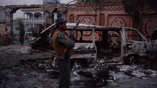 Afghan security forces inspect the site of attack on British charity Save the Children office in Jalalabad. (AFP Photo) Afghan security forces inspect the site of attack on British charity Save the Children office in Jalalabad. (AFP Photo)