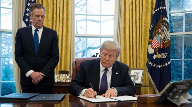 US President Donald Trump signs Section 201 actions to impose tariffs with United States Trade Representative Robert Lighthizer in the Oval Office of the White House in Washington, DC, on January 23, 2018. (AFP) US President Donald Trump signs Section 201 actions to impose tariffs with United States Trade Representative Robert Lighthizer in the Oval Office of the White House in Washington, DC, on January 23, 2018. (AFP)