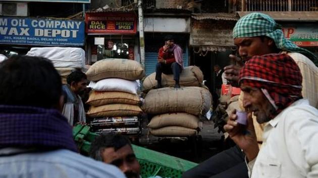 A labourer talks on his mobile phone as he sits on the sacks of spices at a wholesale spice and chemical market in Delhi.(Reuters File Photo) A labourer talks on his mobile phone as he sits on the sacks of spices at a wholesale spice and chemical market in Delhi.(Reuters File Photo)