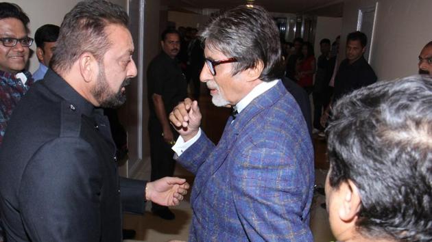 Amitabh Bachchan and Sanjay Dutt sharing a light moment at the awards ceremony. (HT Photo)