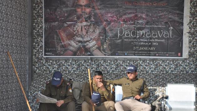 Policemen on duty at a theatre in Dehradun on Thursday.(HT Photo)