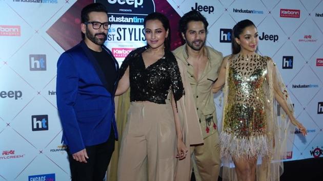 Sonakshi Sinha, Varun Dhawan and Kiara Advani at the red carpet. (HT Photo)