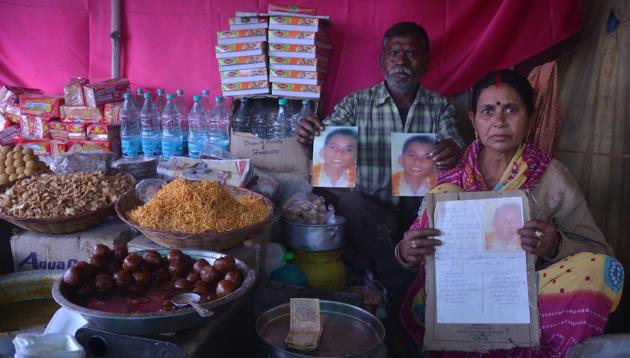 Leelawati with the poster of her missing son at her tea shop in Magh Mela area. (HT Photo) Leelawati with the poster of her missing son at her tea shop in Magh Mela area. (HT Photo)