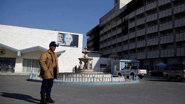 An Afghan security guard stands in front of the Intercontinental Hotel after an attack in Kabul, Afghanistan, on January 23, 2018.(Reuters)