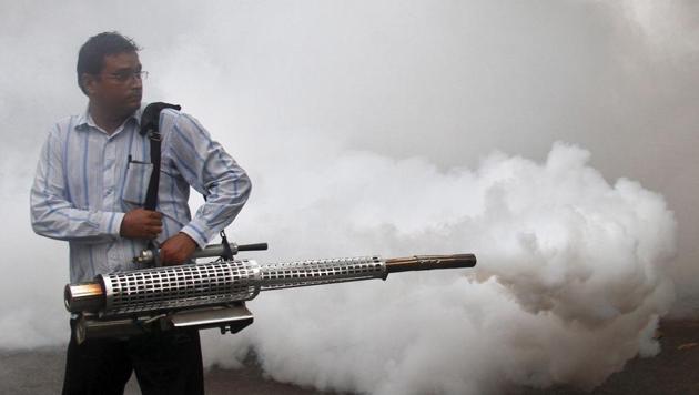 A health worker fumigates a residential area to prevent the spread of dengue fever in Chandigarh. (REUTERS FILE)