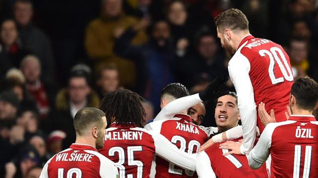 Arsenal's Swiss midfielder Granit Xhaka celebrates scoring the team's second goal with teammates during the League Cup semi-final football match against Chelsea at the Emirates Stadium in London on Wednesday. (AFP) Arsenal's Swiss midfielder Granit Xhaka celebrates scoring the team's second goal with teammates during the League Cup semi-final football match against Chelsea at the Emirates Stadium in London on Wednesday. (AFP)