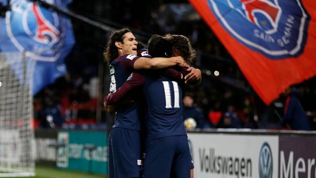 Paris Saint-Germain's French midfielder Adrien Rabiot (R) celebrates with teammates after scoring a goal during the French Cup round of 16 football match between Paris Saint-Germain (PSG) and Guingamp (EAG) at the Parc des Princes stadium in Paris on Wednesday. (AFP) Paris Saint-Germain's French midfielder Adrien Rabiot (R) celebrates with teammates after scoring a goal during the French Cup round of 16 football match between Paris Saint-Germain (PSG) and Guingamp (EAG) at the Parc des Princes stadium in Paris on Wednesday. (AFP)