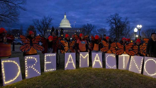 Demonstrators rally in support of Deferred Action for Childhood Arrivals (DACA) outside the Capitol in Washington. Democrats have been seeking a deal to protect the "Dreamers," who have been shielded against deportation by DACA, which President Donald Trump halted last year. (AP) Demonstrators rally in support of Deferred Action for Childhood Arrivals (DACA) outside the Capitol in Washington. Democrats have been seeking a deal to protect the "Dreamers," who have been shielded against deportation by DACA, which President Donald Trump halted last year. (AP)
