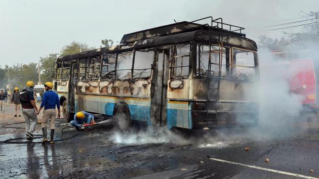 Firefighters douse a fire after a Haryana Roadways bus was torched during a demonstration against the release of Padmaavat, Gurugram, January 24(PTI)