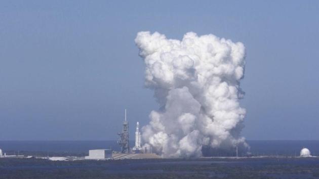 In this image from video made available by SpaceX, a Falcon Heavy rocket is test fired at Cape Canaveral, Fla., on Wednesday, Jan. 24, 2018. The rocket's three boosters — 27 engines in all — were ignited. (AP) In this image from video made available by SpaceX, a Falcon Heavy rocket is test fired at Cape Canaveral, Fla., on Wednesday, Jan. 24, 2018. The rocket's three boosters — 27 engines in all — were ignited. (AP)