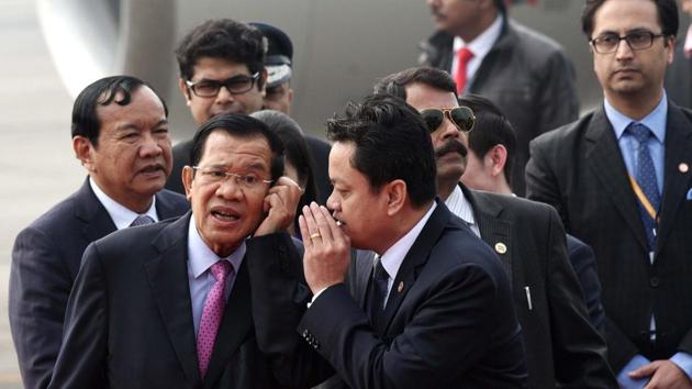 Prime Minister of Cambodia Hun Sen (L) interacts with an official after arriving at Air Force Station Palam for the Association of Southeast Asian Nations (ASEAN) commemorative summit, in New Delhi on Wednesday. (Arvind Yadav/HT Photo) Prime Minister of Cambodia Hun Sen (L) interacts with an official after arriving at Air Force Station Palam for the Association of Southeast Asian Nations (ASEAN) commemorative summit, in New Delhi on Wednesday. (Arvind Yadav/HT Photo)
