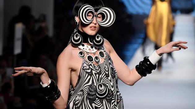 Model Anna Cleveland presents a creation by Jean-Paul Gaultier. Psychedelic swirls, Beatles-style bobs in vibrant colours and plenty of swishing fringes filled Jean Paul Gaultier’s runway in homage to Pierre Cardin. (Bertrand Guay / AFP) Model Anna Cleveland presents a creation by Jean-Paul Gaultier. Psychedelic swirls, Beatles-style bobs in vibrant colours and plenty of swishing fringes filled Jean Paul Gaultier’s runway in homage to Pierre Cardin. (Bertrand Guay / AFP)