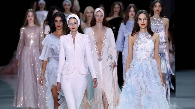 Ralph & Russo, the London-based Australian house, kept a demure presence with its muted blue and beige pallette. (Patrick Kovarik / AFP) Ralph & Russo, the London-based Australian house, kept a demure presence with its muted blue and beige pallette. (Patrick Kovarik / AFP)
