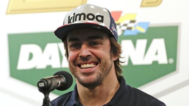 Fernando Alonso of Spain answers questions at a news conference about the IMSA 24-hour auto race at Daytona International Speedway.(AP)