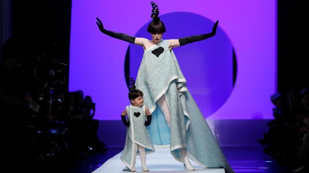 Some during the week struck over-the-top poses as they went, like model Coco Rocha, who had spectators swooning as she took to the catwalk with her two-year-old daughter, dressed identically in an asymetric baby-blue gown. (Gonzales Fuentes / REUTERS) Some during the week struck over-the-top poses as they went, like model Coco Rocha, who had spectators swooning as she took to the catwalk with her two-year-old daughter, dressed identically in an asymetric baby-blue gown. (Gonzales Fuentes / REUTERS)