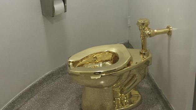 A pot of gold: File photo shows a fully functioning solid gold toilet, made by Italian artist Maurizio Cattelan, which was open for public use at the Guggenheim Museum in New York. (AFP) A pot of gold: File photo shows a fully functioning solid gold toilet, made by Italian artist Maurizio Cattelan, which was open for public use at the Guggenheim Museum in New York. (AFP)