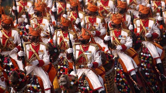 The Border Security Force contingent on decked out camels marches through Rajpath, its troops in matching moustaches and all taller than 6 feet. (Adnan Abidi / REUTERS)
