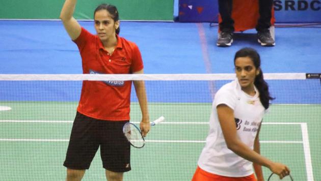 Saina Nehwal defeated PV Sindhu in straight games to enter the semi-finals of the Indonesia Open badminton tournament on Friday.(PTI)