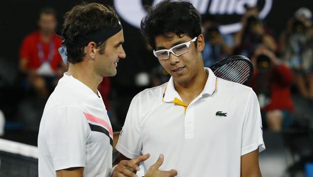 South Korea's Chung Hyeon with Switzerland's Roger Federer after Chung Hyeon retired from the Australian Open semi-final match due to injury.(REUTERS)