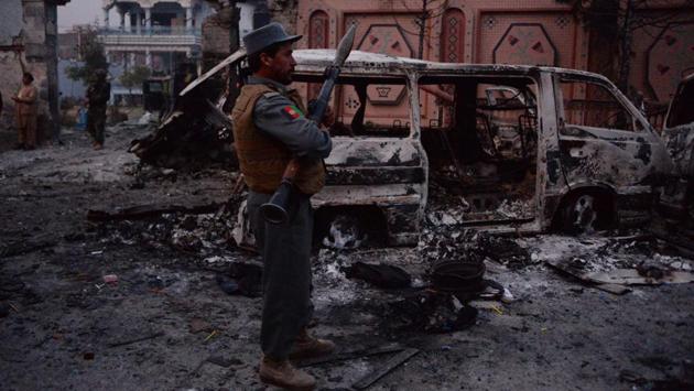 An Afghan security personnel inspects the site of attack on the British charity, Save the Children’s office in Jalalabad on January 24, 2018. (Noorullah Shirzada / AFP) An Afghan security personnel inspects the site of attack on the British charity, Save the Children’s office in Jalalabad on January 24, 2018. (Noorullah Shirzada / AFP)