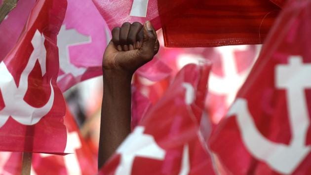 A demonstrator holds his fist in the air as members of Communist Party of India (CPI) along with Trade Unions protest demanding a standardization of minimum monthly wages of 18000 INR (USD $283) to working labourers in Chennai on Thursday. (Arun Sankar / AFP) A demonstrator holds his fist in the air as members of Communist Party of India (CPI) along with Trade Unions protest demanding a standardization of minimum monthly wages of 18000 INR (USD $283) to working labourers in Chennai on Thursday. (Arun Sankar / AFP)