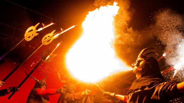 Revellers in costumes take part in the traditional "Correfoc" festival in Palma de Mallorca on January 21, 2018. The Correfoc is a night of revelry in which participants dress as demons and devils, and move through the streets scaring people with fire and fireworks. (Jaime Reina / AFP) Revellers in costumes take part in the traditional "Correfoc" festival in Palma de Mallorca on January 21, 2018. The Correfoc is a night of revelry in which participants dress as demons and devils, and move through the streets scaring people with fire and fireworks. (Jaime Reina / AFP)