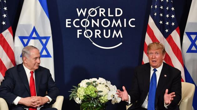 US President Donald Trump (R) with Israel's Prime Minister Benjamin Netanyahu during a bilateral meeting on the sidelines of the World Economic Forum (WEF) annual meeting in Davos on January 25, 2018. (Nicholas Kamm / AFP) US President Donald Trump (R) with Israel's Prime Minister Benjamin Netanyahu during a bilateral meeting on the sidelines of the World Economic Forum (WEF) annual meeting in Davos on January 25, 2018. (Nicholas Kamm / AFP)