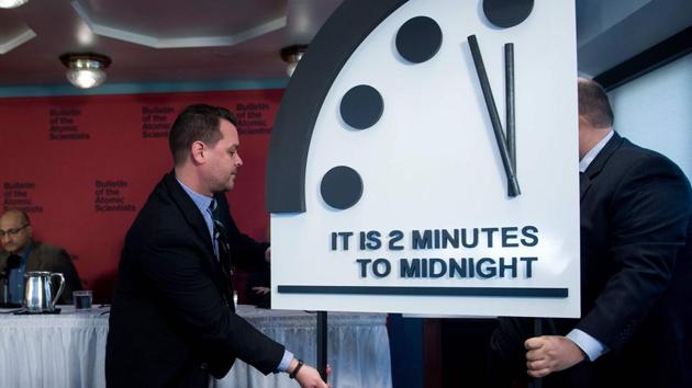 Members of the Bulletin of the Atomic Scientists take their seats after moving their Doomsday clock 30 seconds closer to the end of the world, on January 25, 2018 in Washington, DC. (AFP) Members of the Bulletin of the Atomic Scientists take their seats after moving their Doomsday clock 30 seconds closer to the end of the world, on January 25, 2018 in Washington, DC. (AFP)