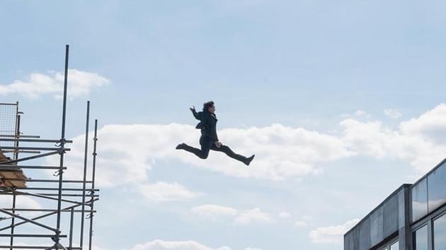 Tom Cruise leaps of a building while shooting Mission: Impossible - Fallout.