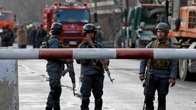 Afghan police keep watch at the site of a car bomb attack. “It is a massacre,” said Dejan Panic coordinator in Afghanistan for the Italian aid group Emergency, which runs a nearby trauma hospital. (Omar Sobhani / REUTERS)
