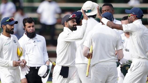 Indian cricket team captain Virat Kohli celebrates with teammates after winning the third Test against South Africa cricket team at Wanderers cricket ground in Johannesburg on Saturday.(AFP)