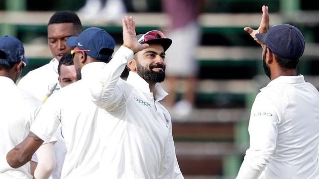 Indian cricket team captain Virat Kohli celebrates with teammates after winning the third Test against South Africa cricket team at the Wanderers in Johannesburg on Saturday. The win has ensured India will retain the ICC Test Championship mace.(AFP)