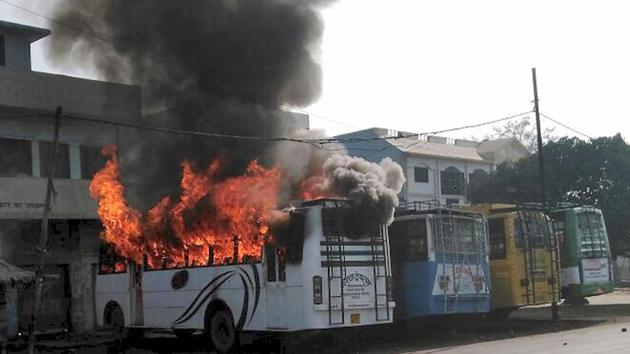 A bus set on fire by a group that went on the rampage after the cremation of a young man killed on Friday during a bike rally, in Kasganj on Saturday. (PTI) A bus set on fire by a group that went on the rampage after the cremation of a young man killed on Friday during a bike rally, in Kasganj on Saturday. (PTI)