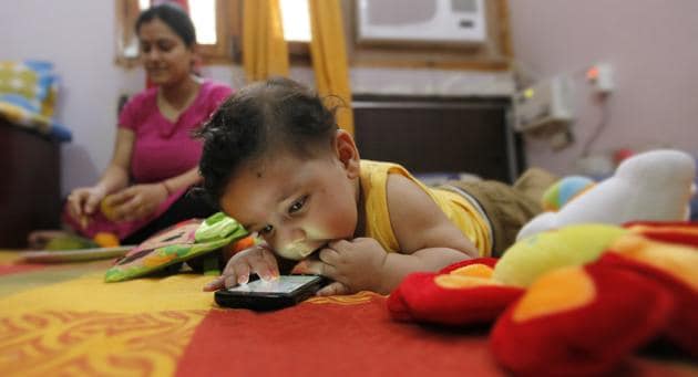 Aayansh has been hooked to his mother’s smartphone since he was five months old. Now three, he has trouble understanding why he can’t take it to nursery school. ‘He puts it down only at bedtime,’ says his mother.(Raj K Raj / HT File Photo)