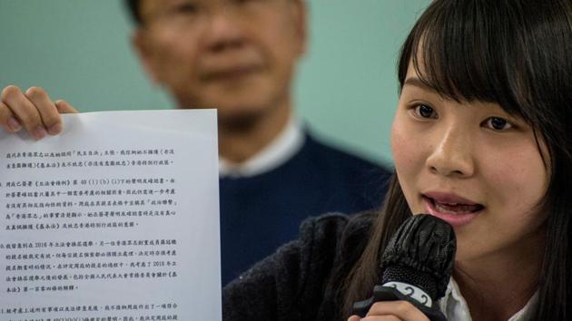 Pro-democracy student Agnes Chow holds a document from the government as she is being banned from the election on January 27, 2018. (AFP Photo) Pro-democracy student Agnes Chow holds a document from the government as she is being banned from the election on January 27, 2018. (AFP Photo)