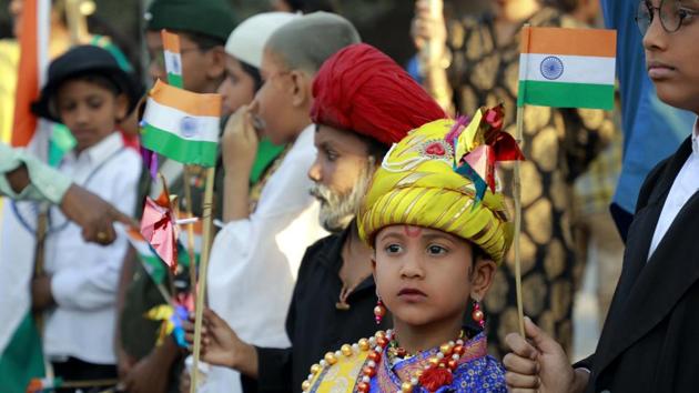 One of the kids dressed up as a freedom fighter looks intrigued by the various events happening on the eve of Republic Day at Shaniwarwada on January 25. (Rahul Raut/HT PHOTO) 