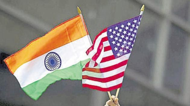 A man holds the flags of India and the US while people take part in the 35th India Day Parade in New York in August 2015. (Reuters File) A man holds the flags of India and the US while people take part in the 35th India Day Parade in New York in August 2015. (Reuters File)