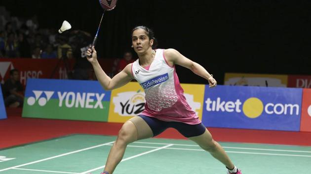 India's Saina Nehwal plays against Thailand's Ratchanok Intanon during the semi-final round of the women's singles match in the Indonesia Masters badminton tournament at Istora Stadium in Jakarta on Saturday.(AP)